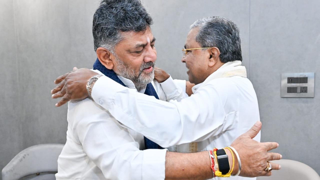 In a picture shared by the Chief Minister's Office, Siddaramaiah is seen hugging Shivakumar. In another picture, CM hopeful Shivakumar is seen touching the feet of Siddaramaiah and taking his blessings. In a picture shared by the Chief Minister's Office, Siddaramaiah is seen hugging Shivakumar. In another picture, CM hopeful Shivakumar is seen touching the feet of Siddaramaiah and taking his blessings.