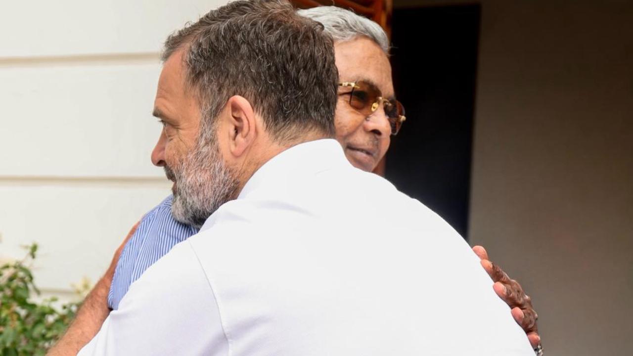 Siddaramaiah received a warm welcome from Rahul Gandhi during the meeting. After greeting Siddaramaiah with a handshake, Rahul Gandhi hugged him and posed for photographs. Siddaramaiah received a warm welcome from Rahul Gandhi during the meeting. After greeting Siddaramaiah with a handshake, Rahul Gandhi hugged him and posed for photographs.