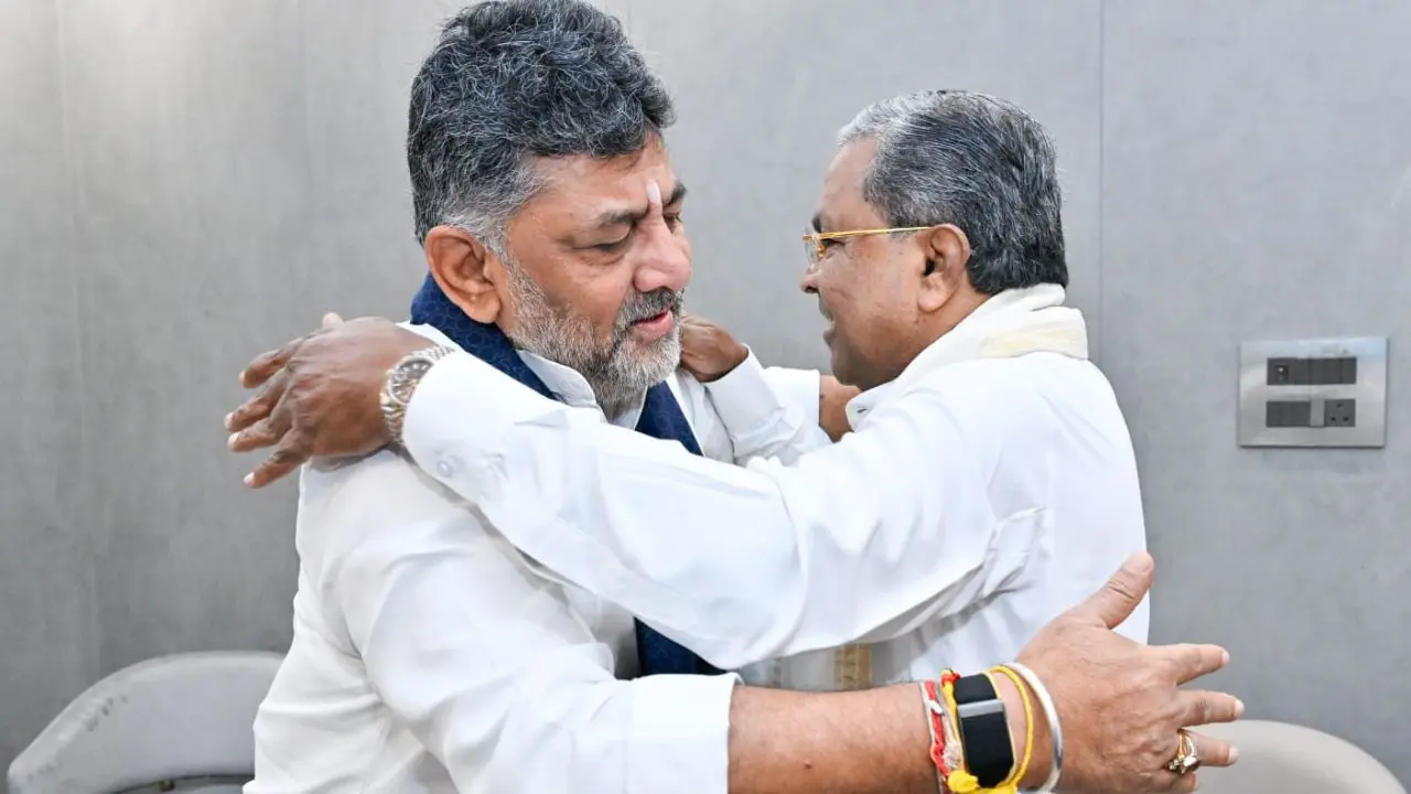 Karnataka CM Siddaramaiah is greeted by Deputy CM DK Shivakumar during a breakfast meeting in Bengaluru on Thursday. PIC/PTI