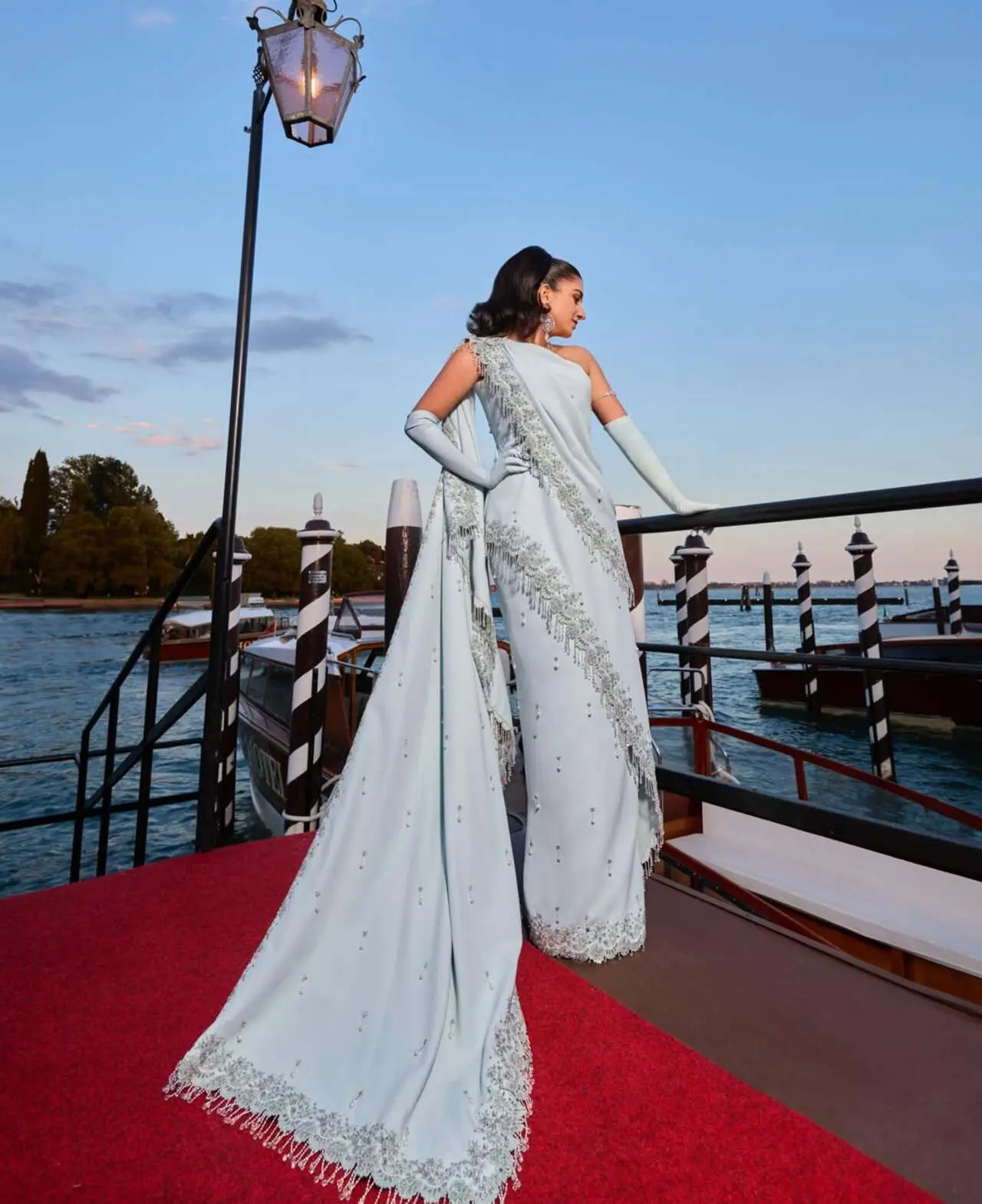 The gown&rsquo;s standout design element was its dramatically draped shoulder detail, which added both softness and sculptural structure to the silhouette