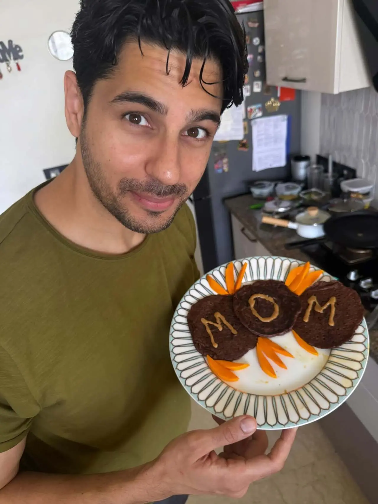 One of the pictures shows her husband Sidharth Malhotra holding a set of pancakes that he specially cooked for his wife One of the pictures shows her husband Sidharth Malhotra holding a set of pancakes that he specially cooked for his wife