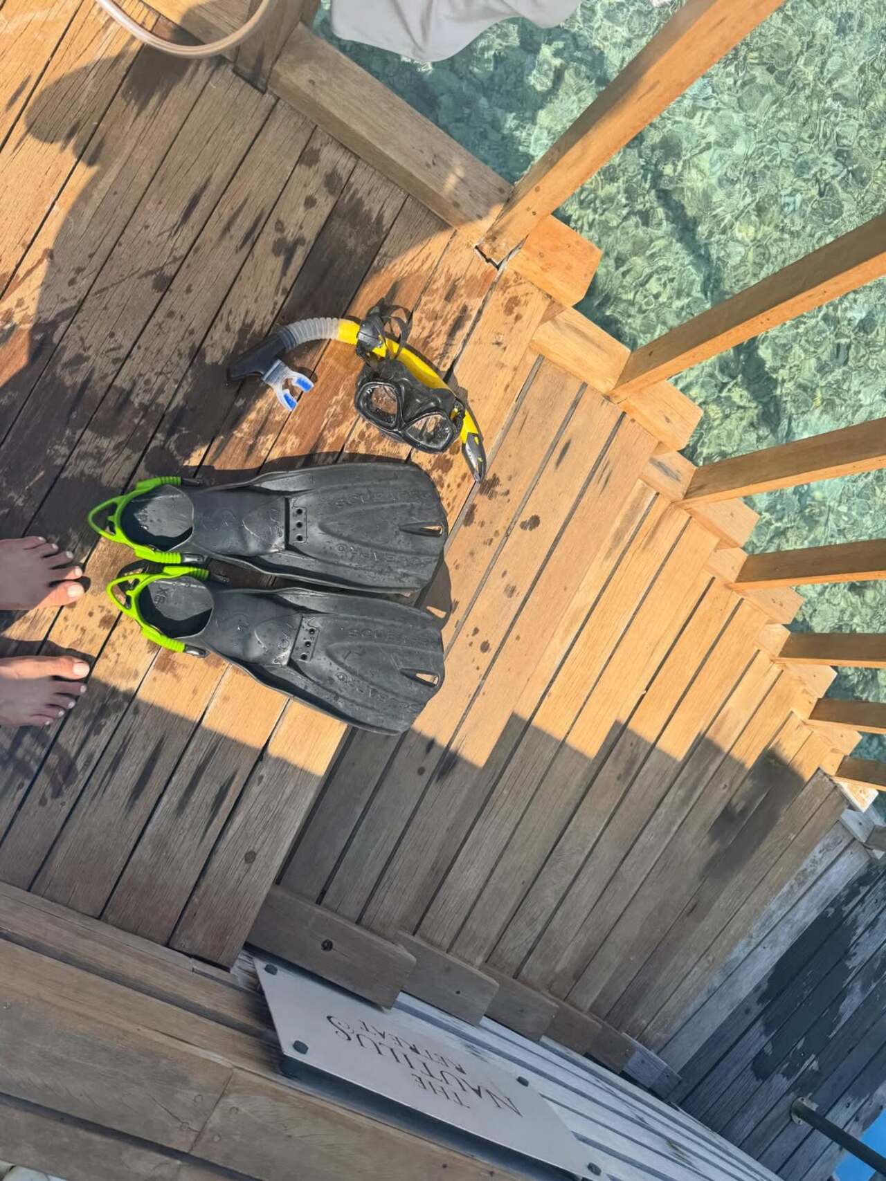 The actress turned into a complete waterbaby at the trip as she shares this glimpse of snorkeling gear neatly placed with black fins and green accents.