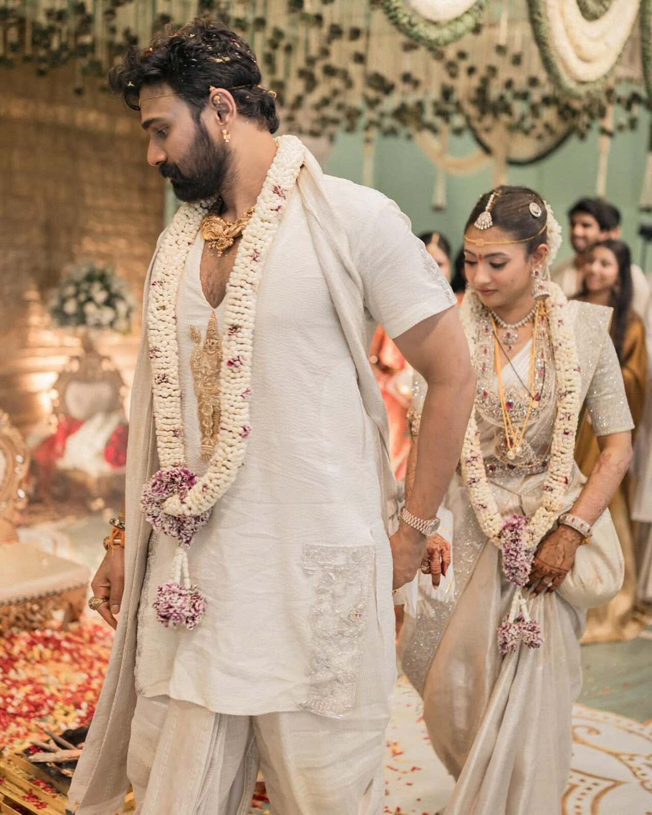 Bellamkonda Sreenivas and Kavya Thapar are seen performing the sacred pheras, walking around the holy fire in a traditional wedding ritual.&nbsp;