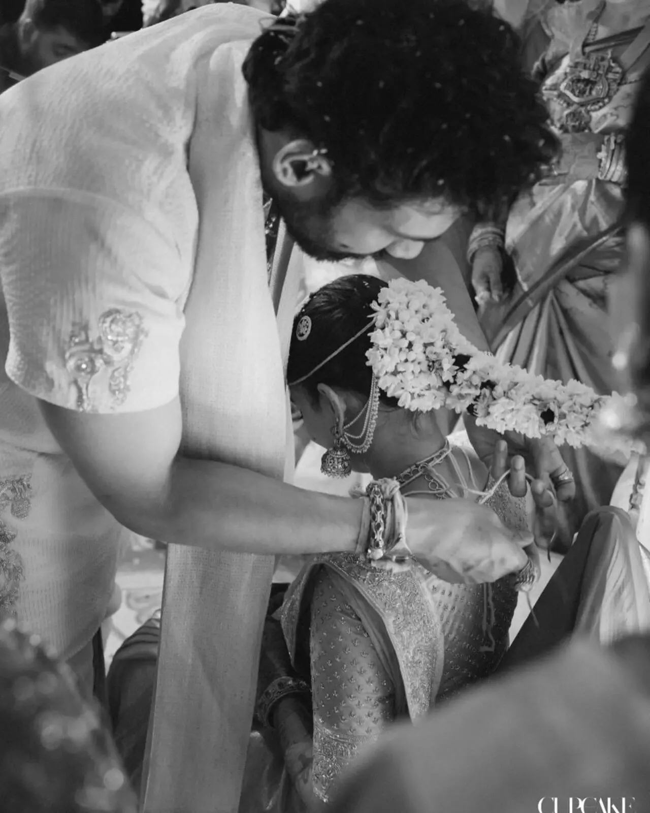 Bellamkonda Sreenivas is seen performing the sacred ritual of tying the mangalsutra around Kavya Reddy&rsquo;s neck, marking a significant moment in the ceremony.