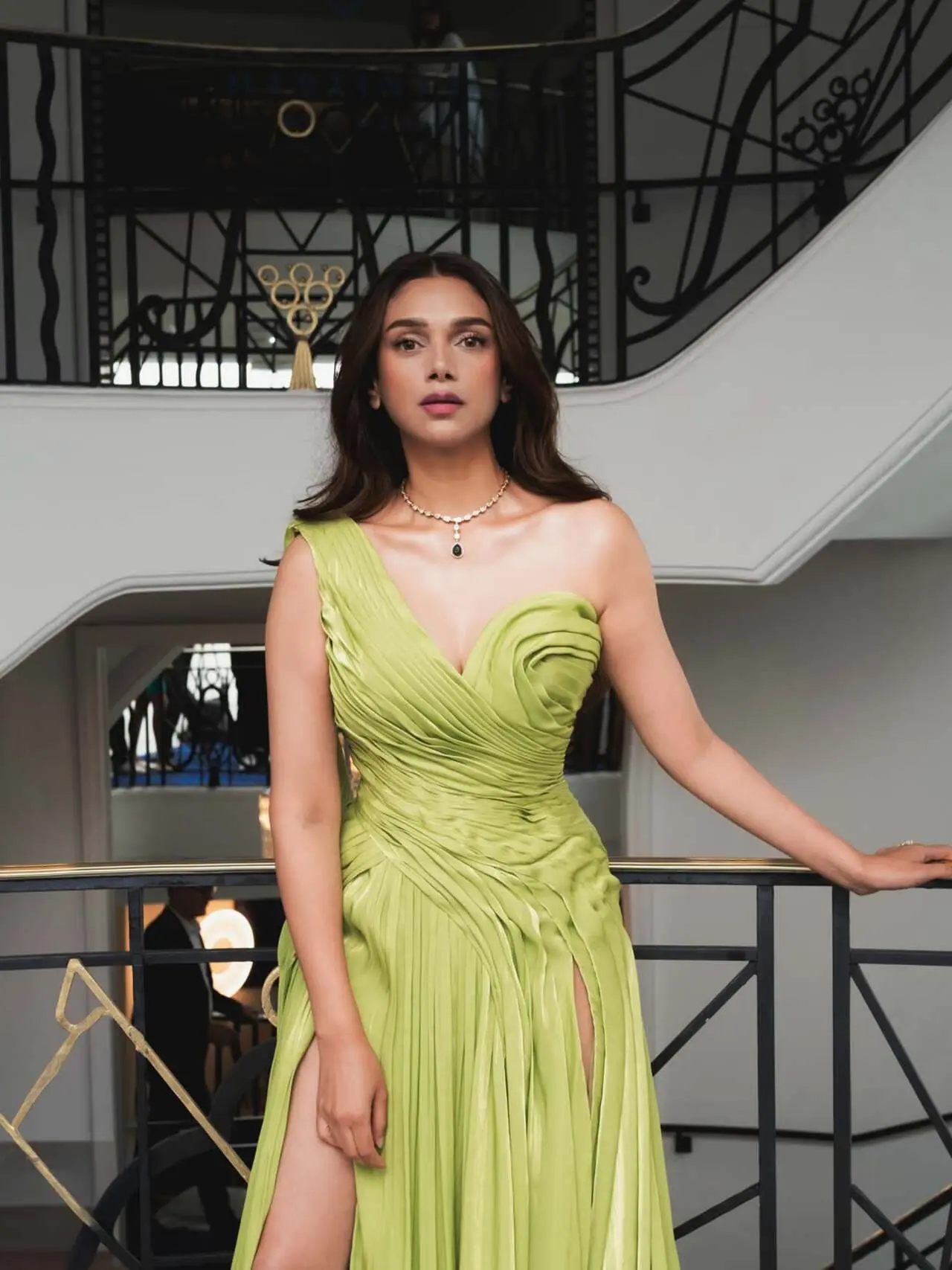 The ensemble featured a structured asymmetrical bodice, a dramatic flowing train, and a daring thigh-high slit. The sweeping cape silhouette added a touch of old-Hollywood glamour while maintaining a contemporary edge. The ensemble featured a structured asymmetrical bodice, a dramatic flowing train, and a daring thigh-high slit. The sweeping cape silhouette added a touch of old-Hollywood glamour while maintaining a contemporary edge.