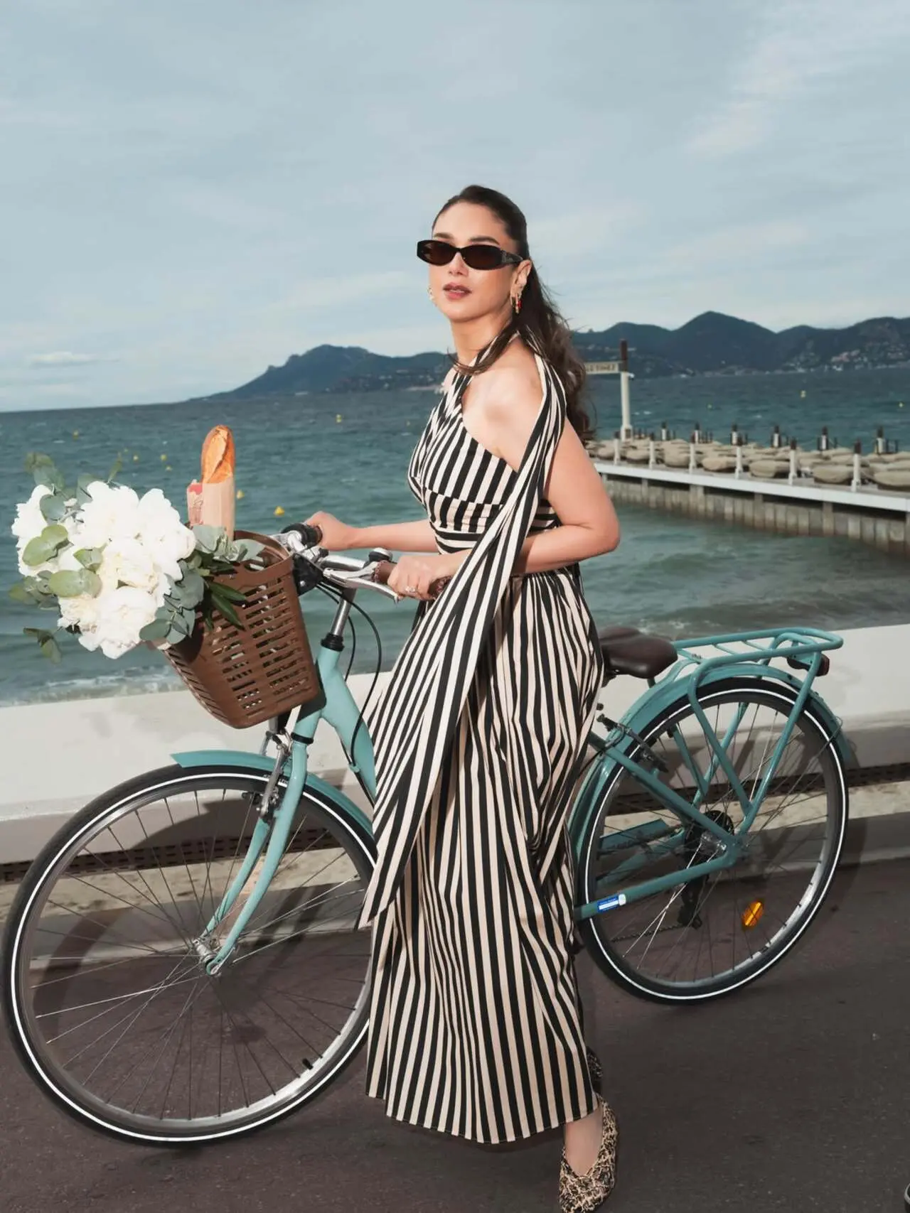 Posing by the seaside with a bicycle, Aditi served the perfect blend of playful charm and timeless elegance. Posing by the seaside with a bicycle, Aditi served the perfect blend of playful charm and timeless elegance.