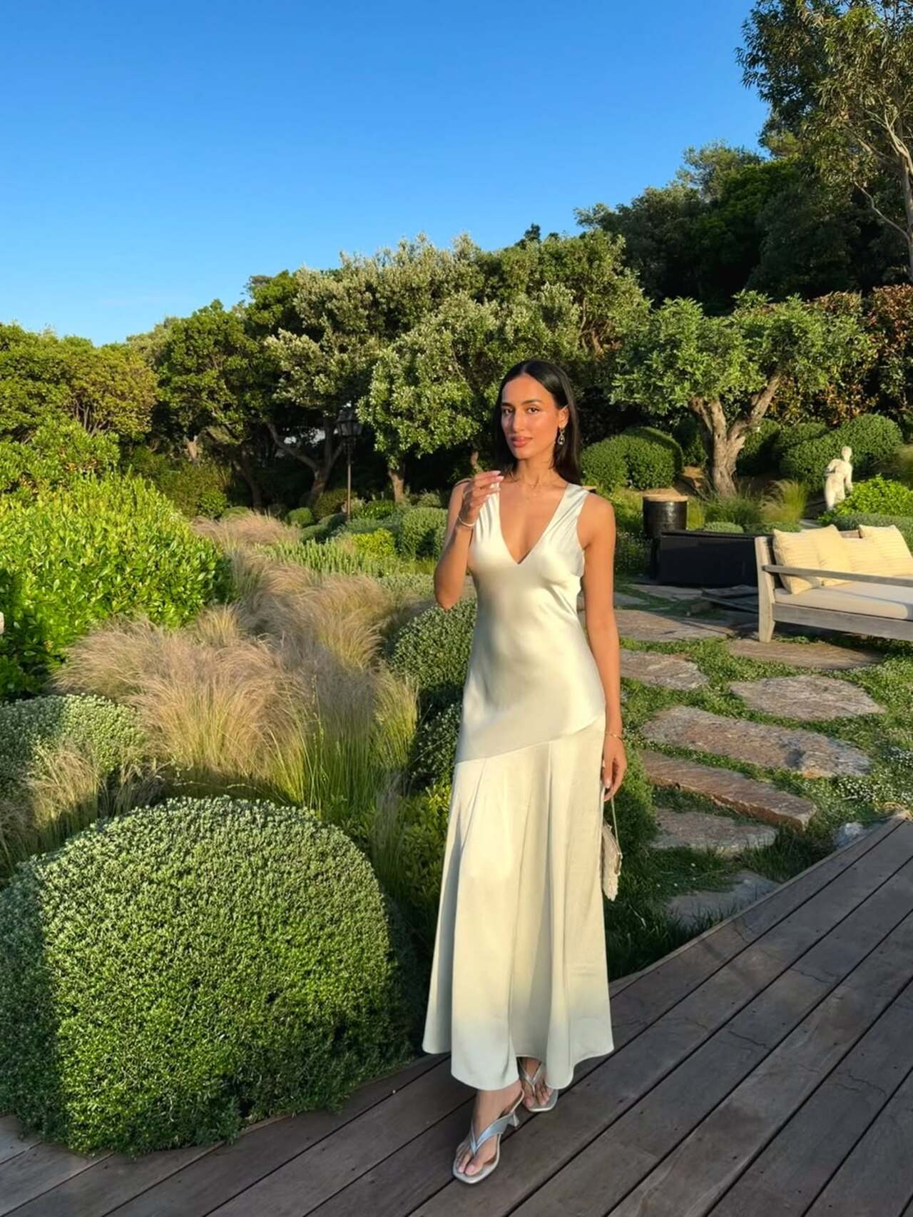 Mahieka Sharma looked effortlessly elegant in this satin ivory slip dress that featured a deep plunging neckline and delicate shoulder straps. Mahieka Sharma looked effortlessly elegant in this satin ivory slip dress that featured a deep plunging neckline and delicate shoulder straps.