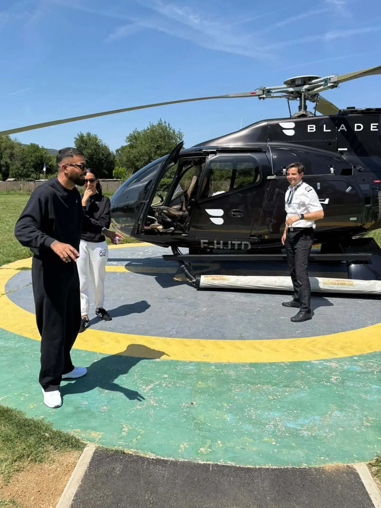 Hardik and Mahieka are seen stepping out near a private helicopter, adding a lavish touch to their dreamy getaway. Hardik and Mahieka are seen stepping out near a private helicopter, adding a lavish touch to their dreamy getaway.