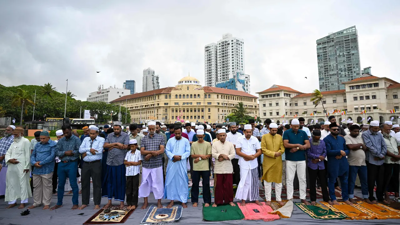 Among many other people around the world, Muslim devotees offer Eid al-Adha prayers at the Galle Face Green in Colombo on May 28 Among many other people around the world, Muslim devotees offer Eid al-Adha prayers at the Galle Face Green in Colombo on May 28