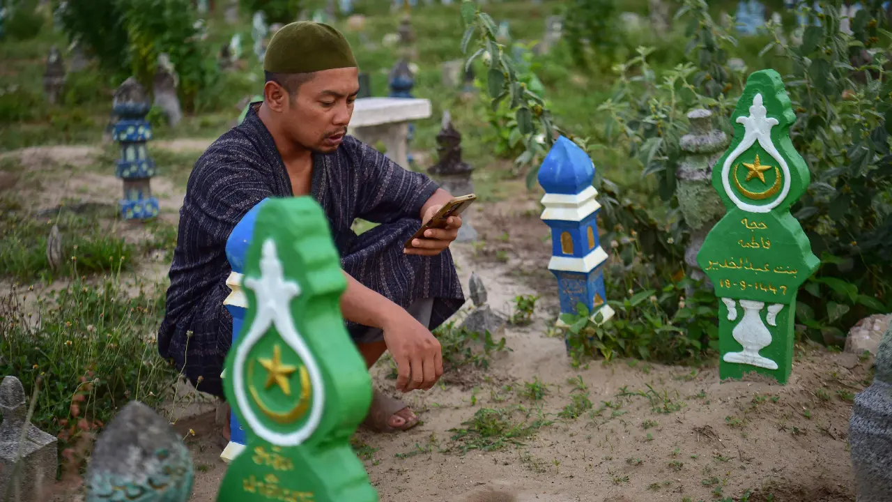 A Thai Muslim visits a cemetery during Eid al-Adha, or Feast of Sacrifice, in Thailand's southern province of Narathiwat on May 28 A Thai Muslim visits a cemetery during Eid al-Adha, or Feast of Sacrifice, in Thailand's southern province of Narathiwat on May 28