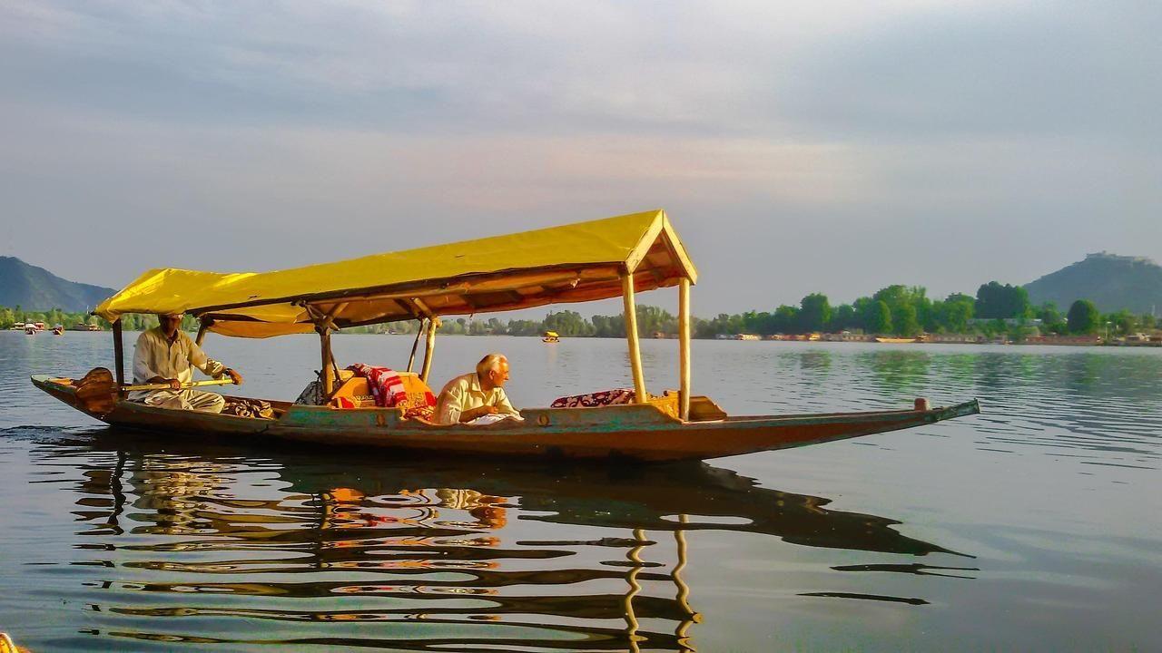 Tourists enjoy pleasant weather in Kashmir amid severe heatwave across India