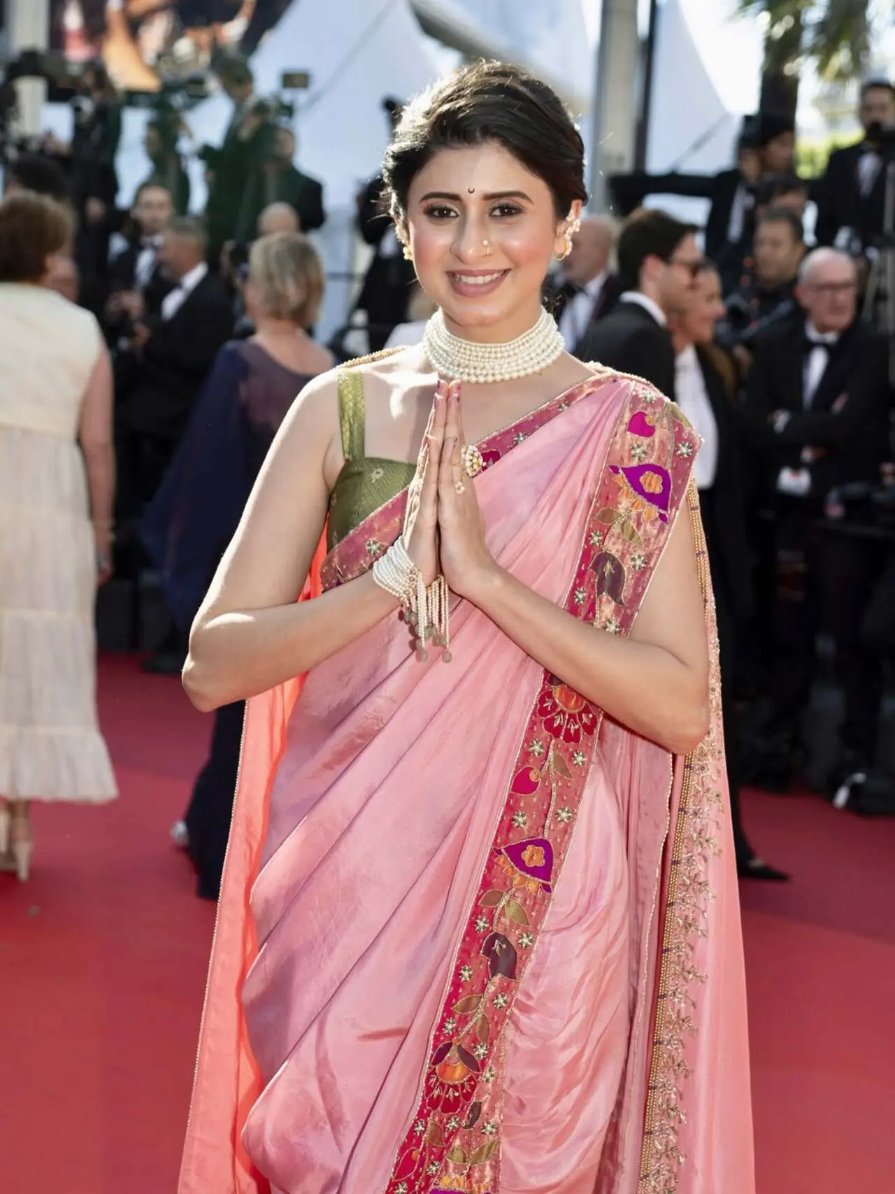 Ankita Walwalkar brings the Maharashtrian culture on a platform like Cannes, with her silk saree. The saree has soft paithani detailed bordered as she pairs it with pearls. She adds a touch of Maharashtra in her hairdo as well. Ankita Walwalkar brings the Maharashtrian culture on a platform like Cannes, with her silk saree. The saree has soft paithani detailed bordered as she pairs it with pearls. She adds a touch of Maharashtra in her hairdo as well.