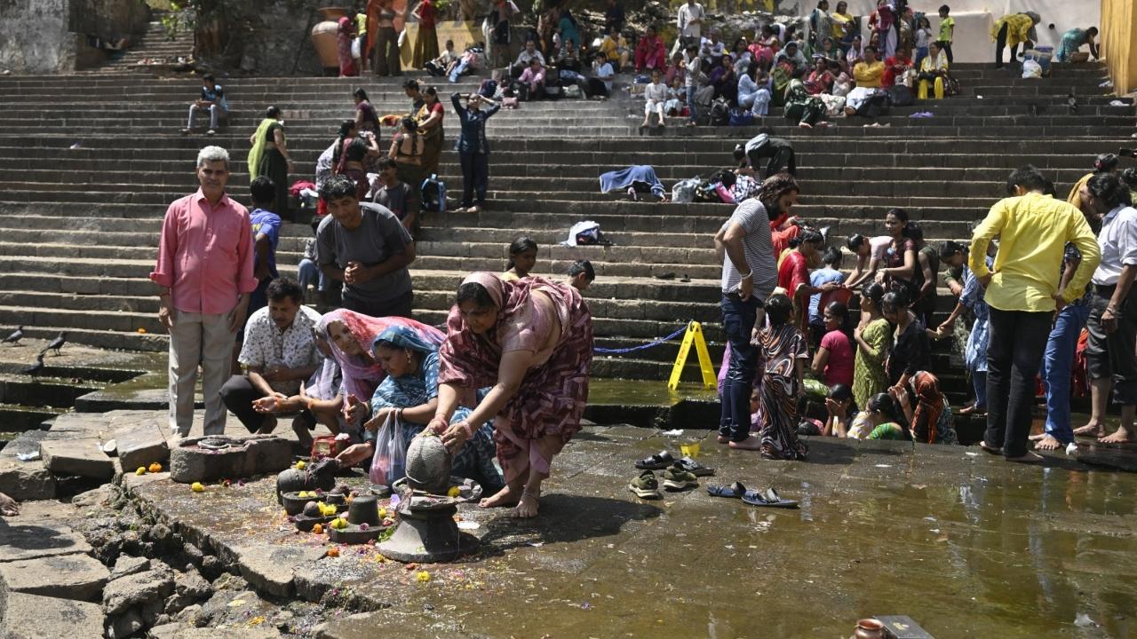 The devotees took a holy dip, known as snan, in the ancient tank in south Mumbai as part of traditional religious observances The devotees took a holy dip, known as snan, in the ancient tank in south Mumbai as part of traditional religious observances