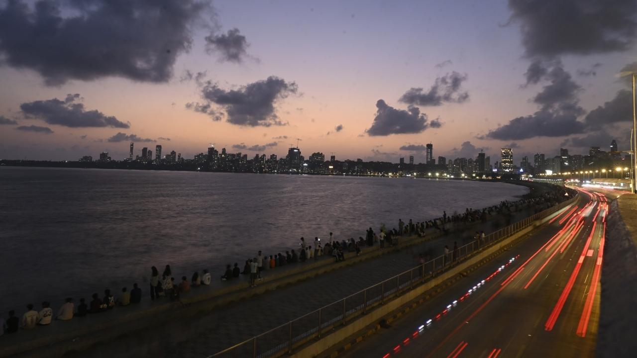 By evening, several residents and visitors gathered along the promenade to enjoy the cooler sea breeze and watch the dark clouds rolling in over the Arabian Sea By evening, several residents and visitors gathered along the promenade to enjoy the cooler sea breeze and watch the dark clouds rolling in over the Arabian Sea