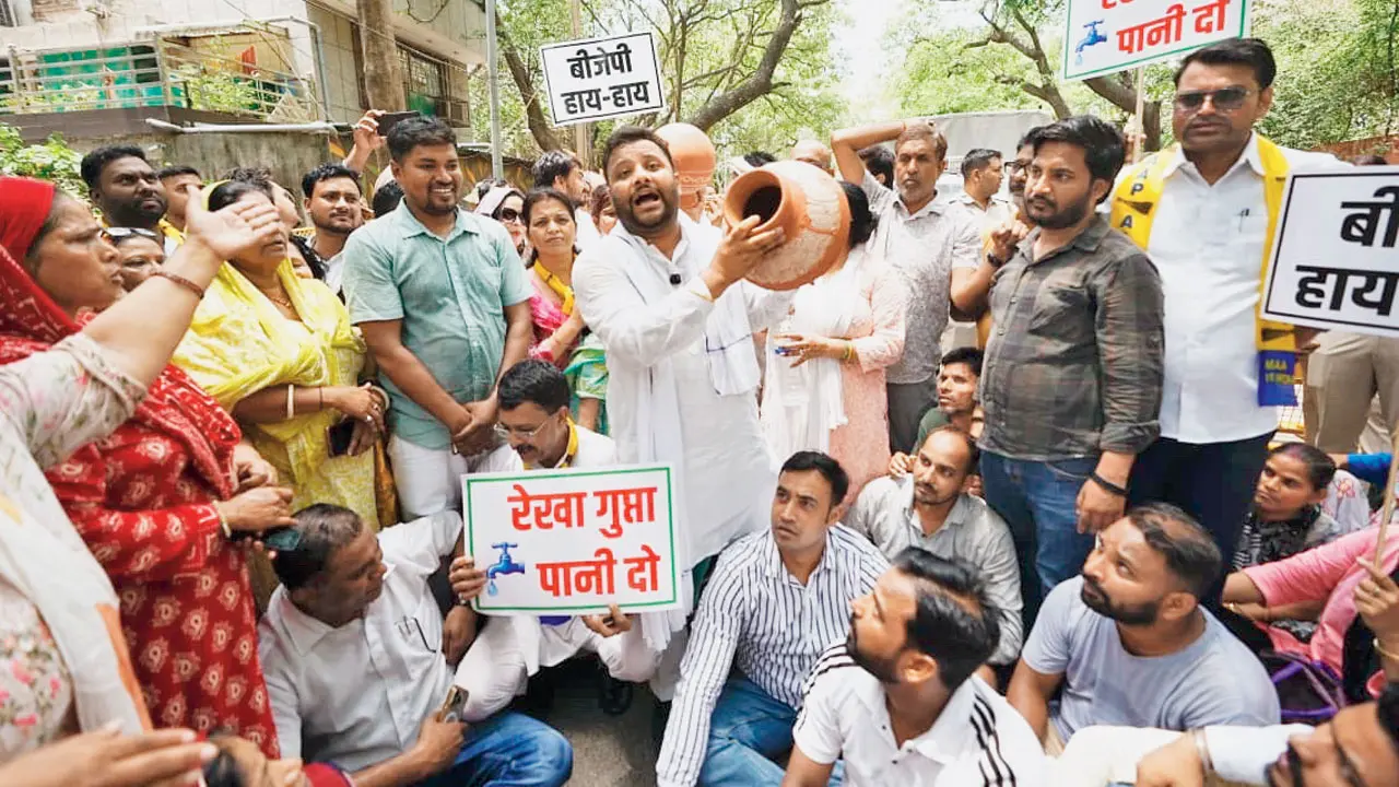 AAP stages ‘Matka Phor’ protest over water shortage in Delhi AAP leaders protest against severe water crisis in Delhi. Pic/PTI