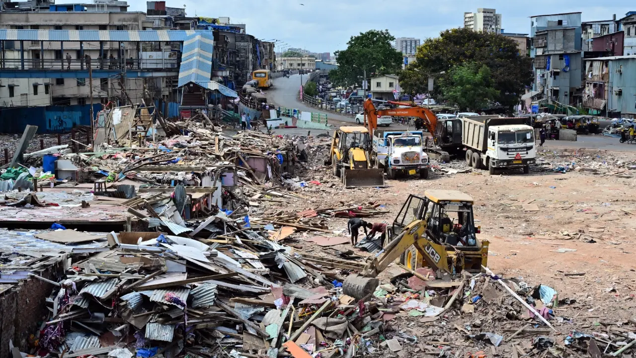 Bandra's Garib Nagar residents awaiting partial demolition of homes on street Clearing operations at the site. PIC/SHADAB KHAN