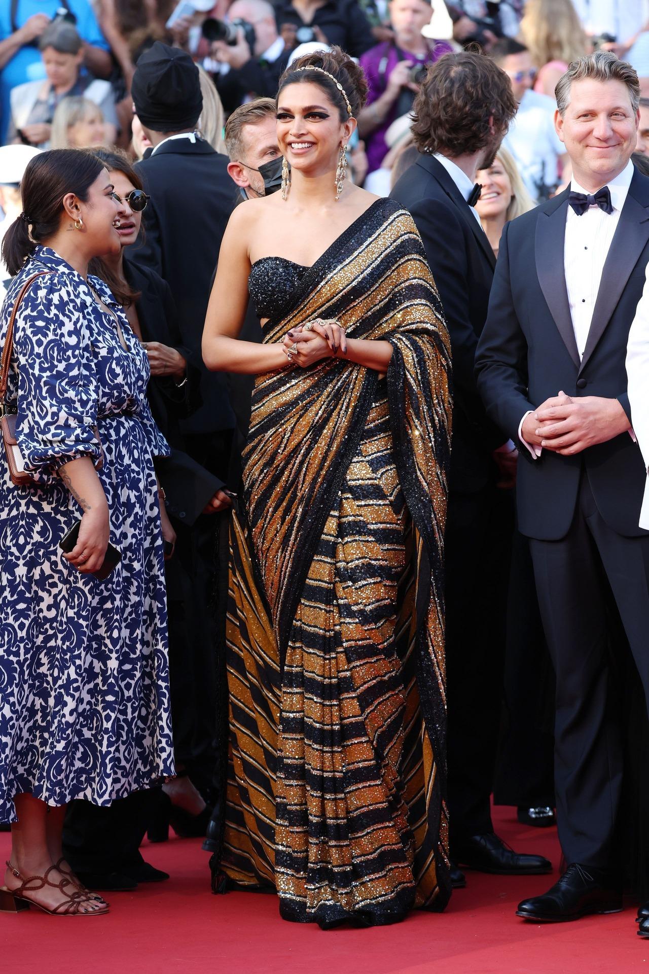Deepika commanded attention in a Sabyasachi striped and sequinned sari at the 2022 Cannes Film Festival.