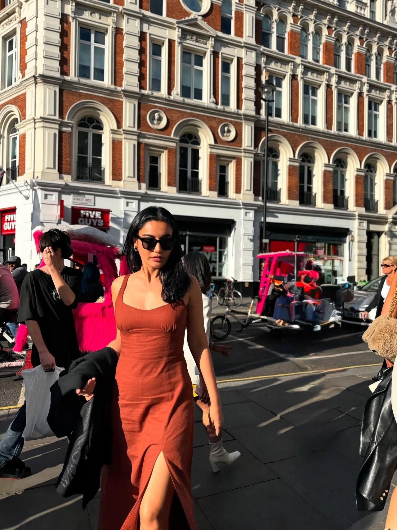 Want to slay with class even in the summers? Take notes from Surbhi Jyoti's burnt orange maxi dress with a thigh-high slit. She completes her classy look in sunglasses and minimal gold jewellery. Want to slay with class even in the summers? Take notes from Surbhi Jyoti's burnt orange maxi dress with a thigh-high slit. She completes her classy look in sunglasses and minimal gold jewellery.