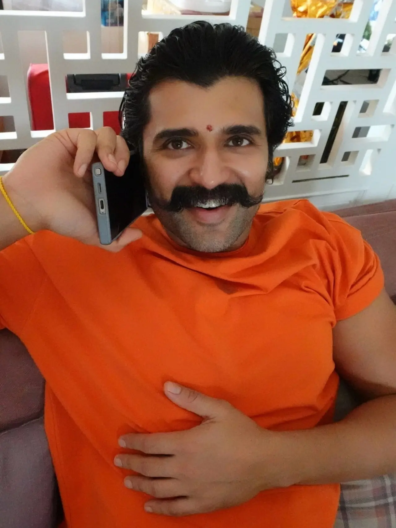 In one of the pictures, Vijay was seen talking on the phone while smiling at the camera, as if caught by surprise. In one of the pictures, Vijay was seen talking on the phone while smiling at the camera, as if caught by surprise.