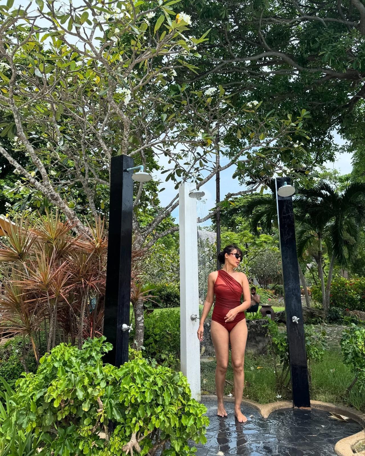 Surbhi beats the heat in this deep red draped one-shoulder swimsuit, while channelling her sexy and sultry side. Surbhi beats the heat in this deep red draped one-shoulder swimsuit, while channelling her sexy and sultry side.