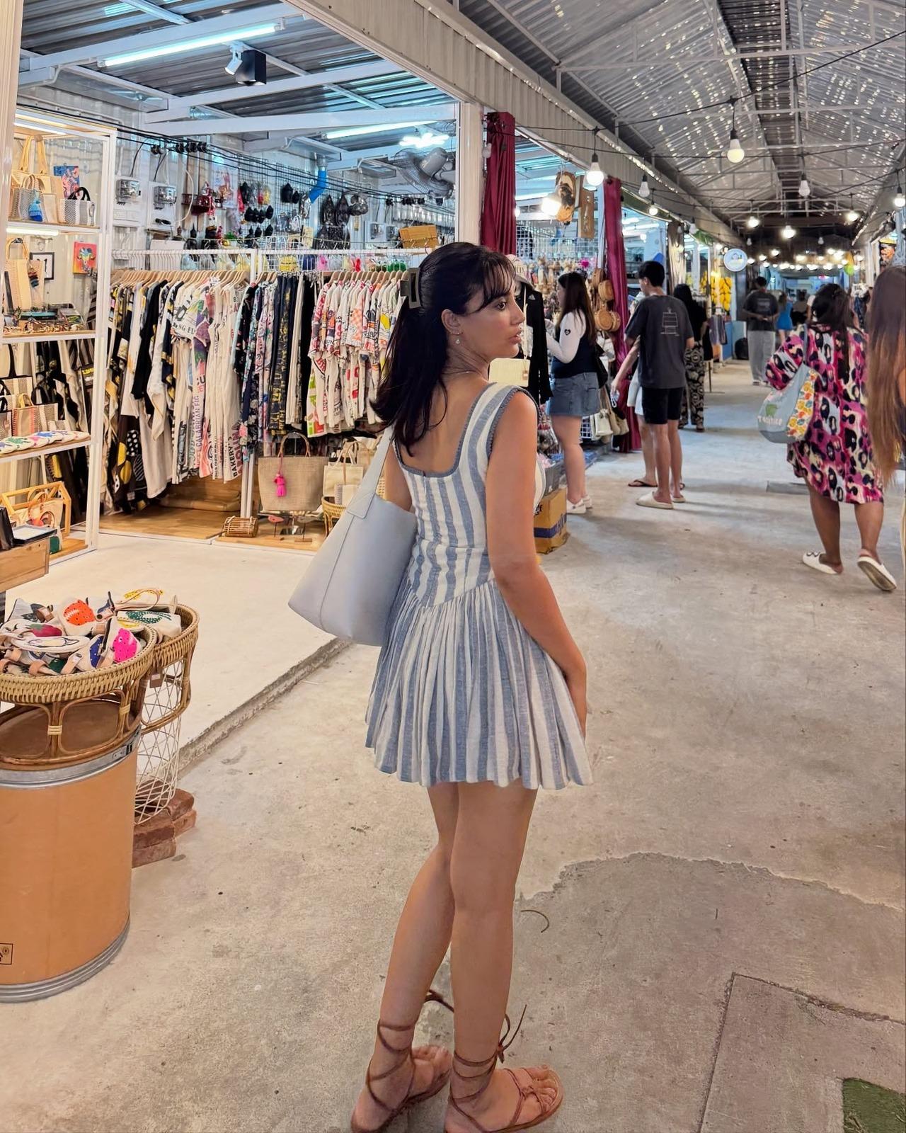 Taking her time off the beaches, Surbhi steps out for a shopping spree in a pinstrip mini dress, pairing it with a tote bag and strappy flats. Taking her time off the beaches, Surbhi steps out for a shopping spree in a pinstrip mini dress, pairing it with a tote bag and strappy flats.