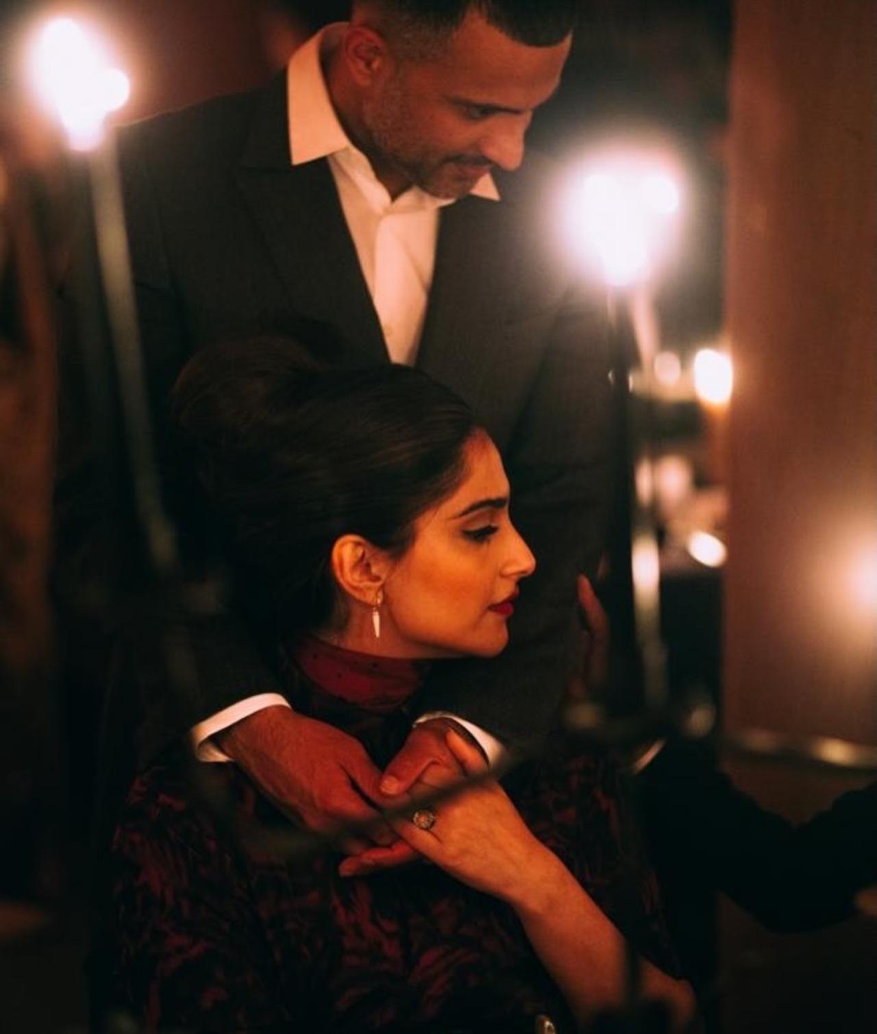 Sonam and Anand share a quite and candid moment in this picture which appears to be from a dressing room. Sonam and Anand share a quite and candid moment in this picture which appears to be from a dressing room. 