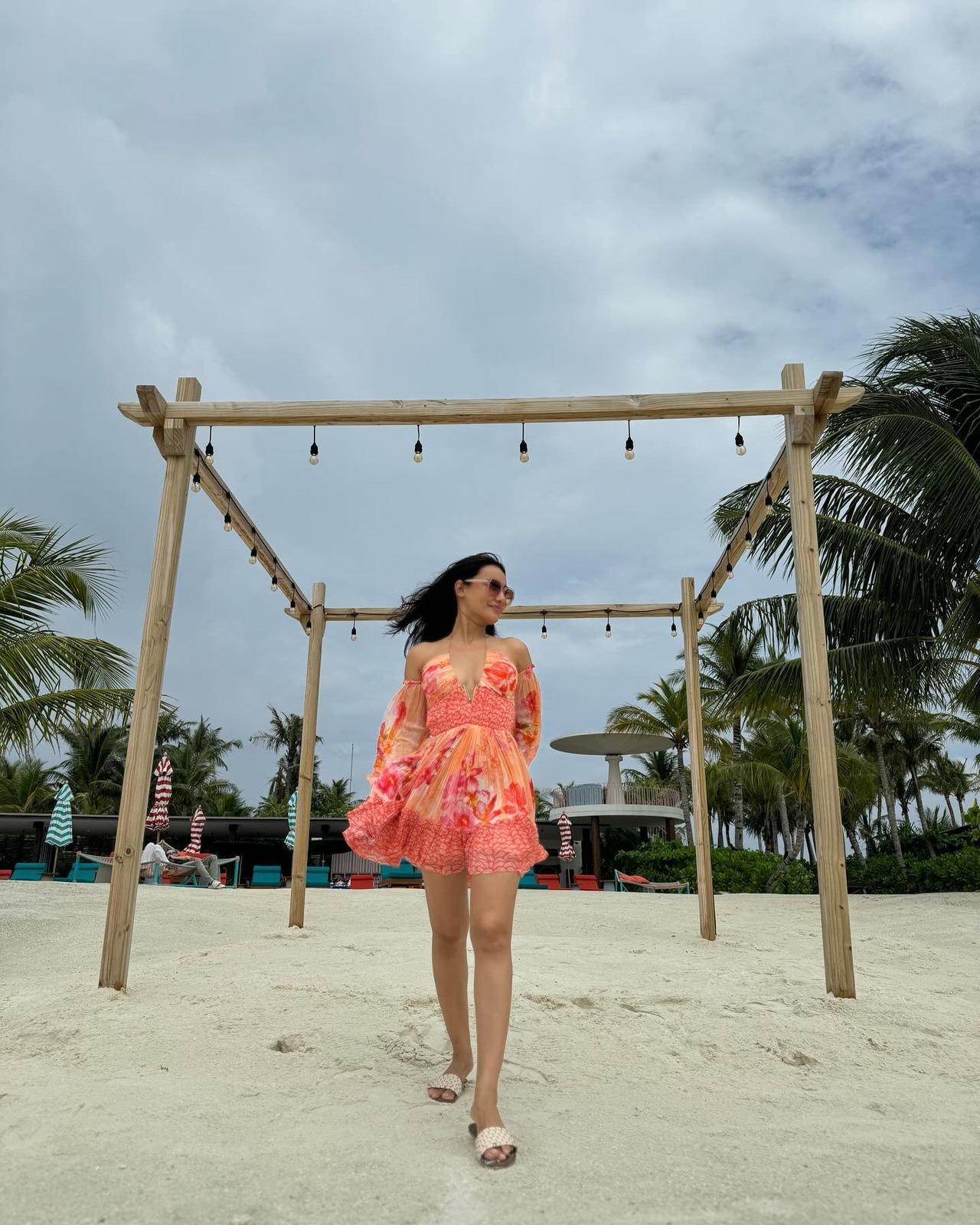 Surbhi slays in this orange chiffon printed mini dress that screams summers. Surbhi slays in this orange chiffon printed mini dress that screams summers.