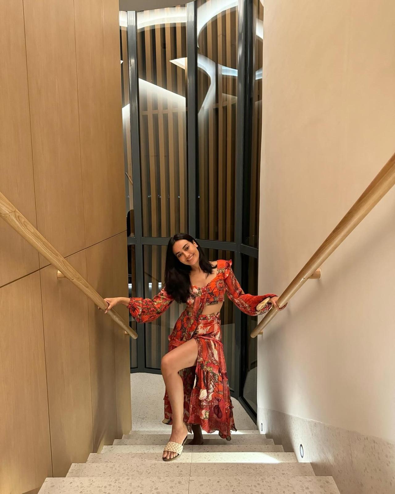 Heading for a party by the beach in the summer, Surbhi's bright orange and white floral print co-ord set, featuring a cropped top and a matching maxi skirt with a central slit, is an easy-breezy pick. Heading for a party by the beach in the summer, Surbhi's bright orange and white floral print co-ord set, featuring a cropped top and a matching maxi skirt with a central slit, is an easy-breezy pick.
