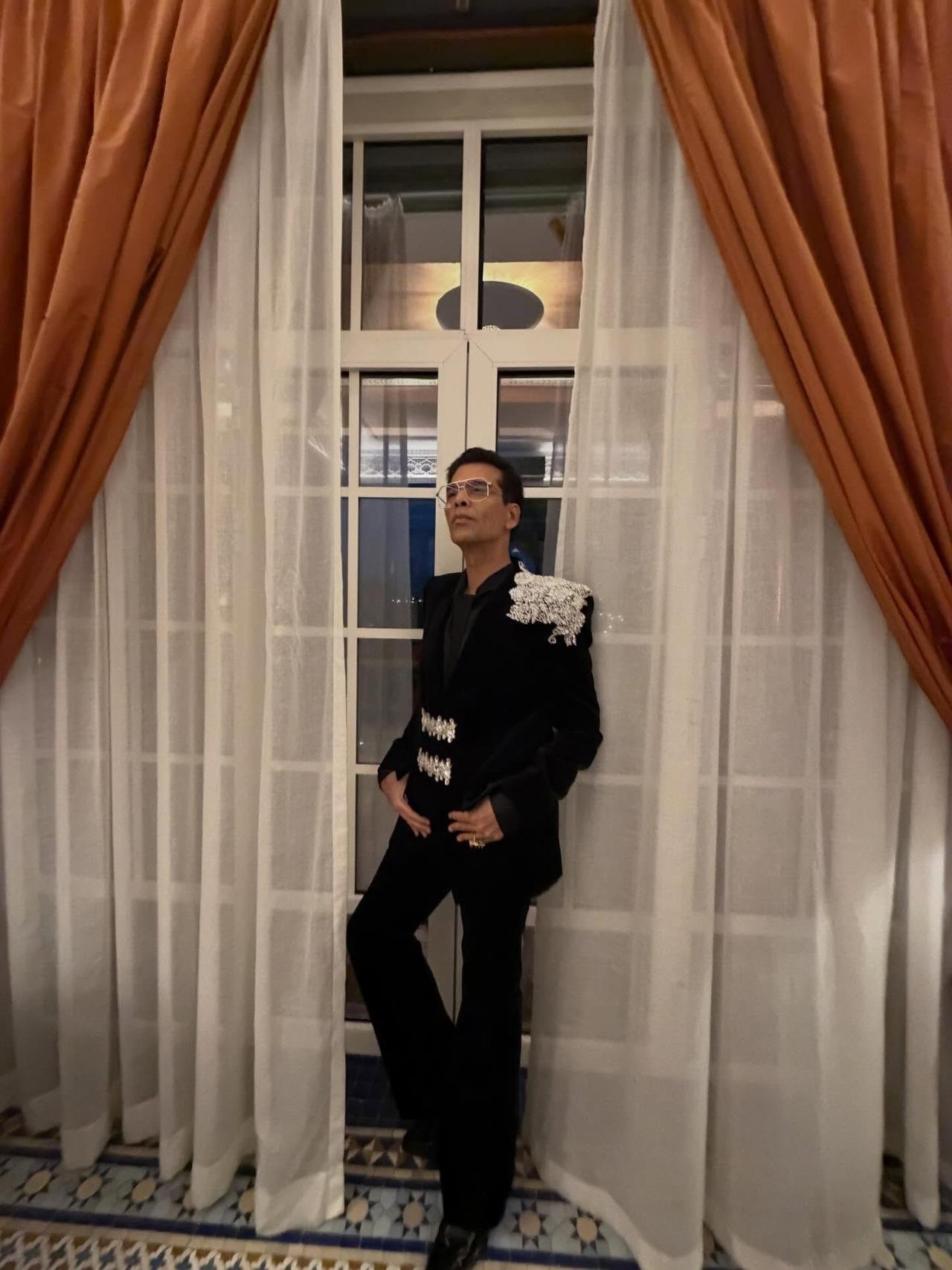 Another black velvet tuxedo, but this time it features silver embroidery over one shoulder and the waist, which makes the outfit look striking and refined.