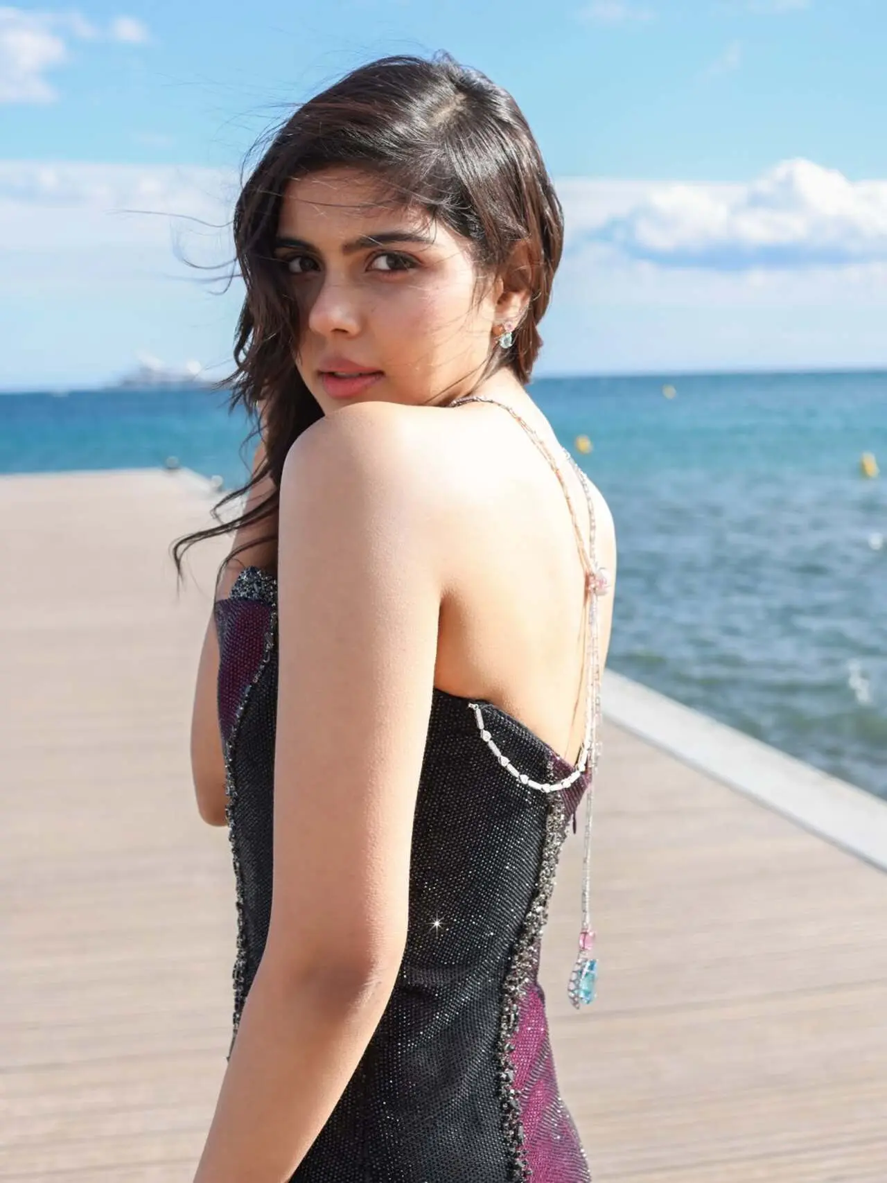 At the 2026 Cannes Film Festival, Kalyani Priyadarshan stunned in a custom dual-tone strapless gown by Indian couture label Itrh. The floor-length ensemble featured a deep purple bodice and shimmering black sides hand-embellished with thousands of beads. Her show-stopping accessory was a Kalyan Jewellers white gold reverse back necklace, showcasing a 52-carat blue sapphire, pink morganites, and 945 diamonds. Voluminous open waves and a soft-glam pink makeup look completed her elegant, high-fashion red carpet debut At the 2026 Cannes Film Festival, Kalyani Priyadarshan stunned in a custom dual-tone strapless gown by Indian couture label Itrh. The floor-length ensemble featured a deep purple bodice and shimmering black sides hand-embellished with thousands of beads. Her show-stopping accessory was a Kalyan Jewellers white gold reverse back necklace, showcasing a 52-carat blue sapphire, pink morganites, and 945 diamonds. Voluminous open waves and a soft-glam pink makeup look completed her elegant, high-fashion red carpet debut