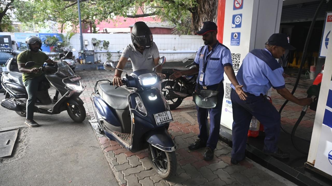 At several fuel stations across the city, including Chagan Mitha Petrol Pump, motorists were seen checking updated fuel prices following the hike