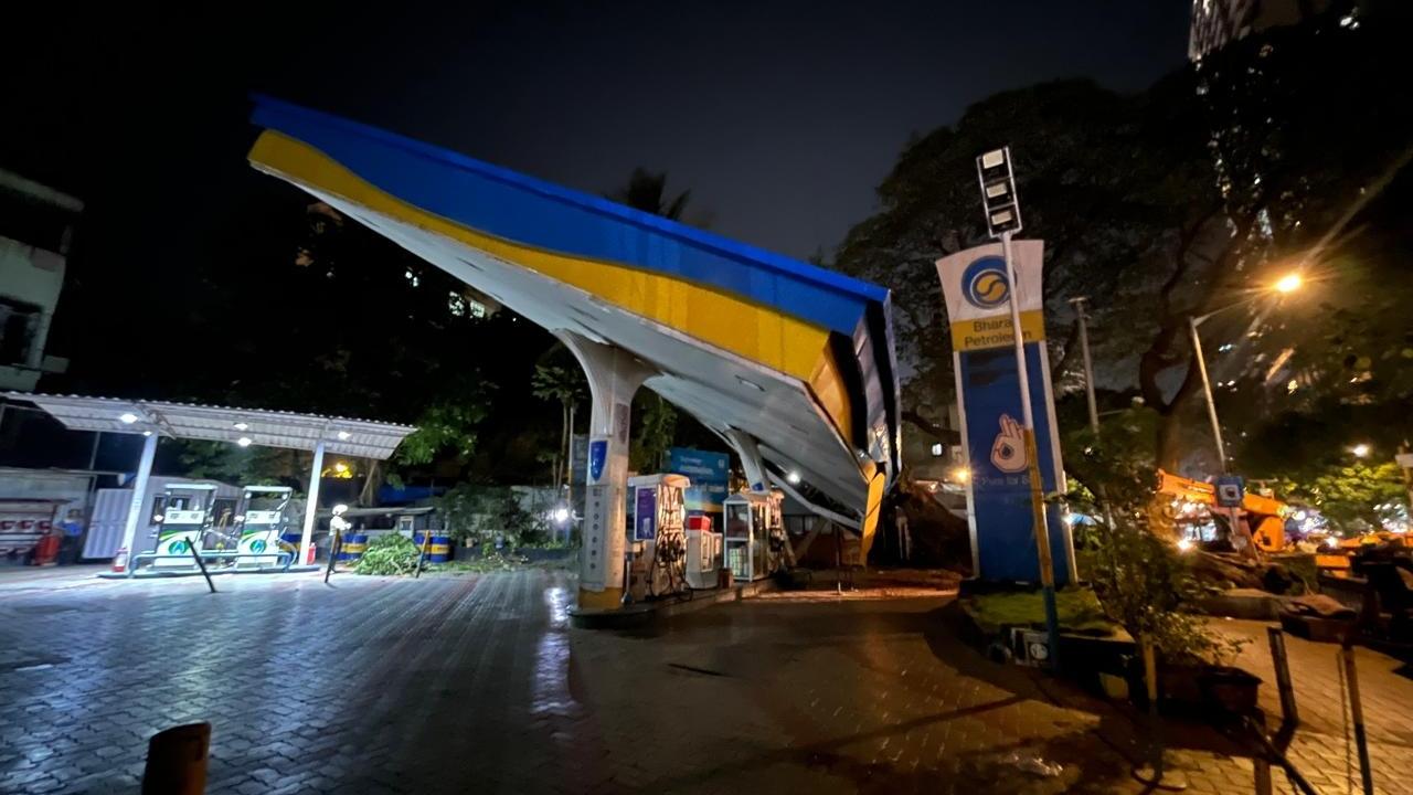 Local residents and motorists rushed to safety after the tree came crashing down on a section of the fuel station, sources said Local residents and motorists rushed to safety after the tree came crashing down on a section of the fuel station, sources said