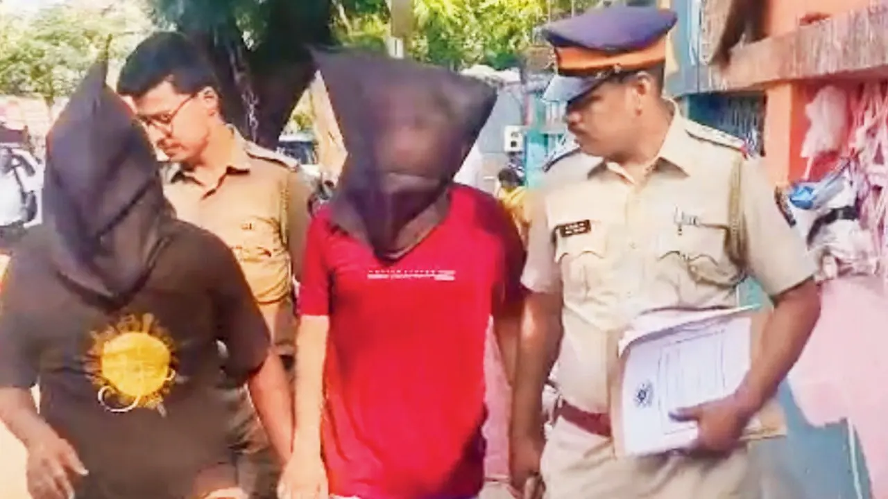 Mumbai: Police arrest two in alleged extortion case involving Malad bar owner Bangur Nagar police with arrested accused Mansuri and DM Jadhav (hooded). Pic/By Special Arrangement