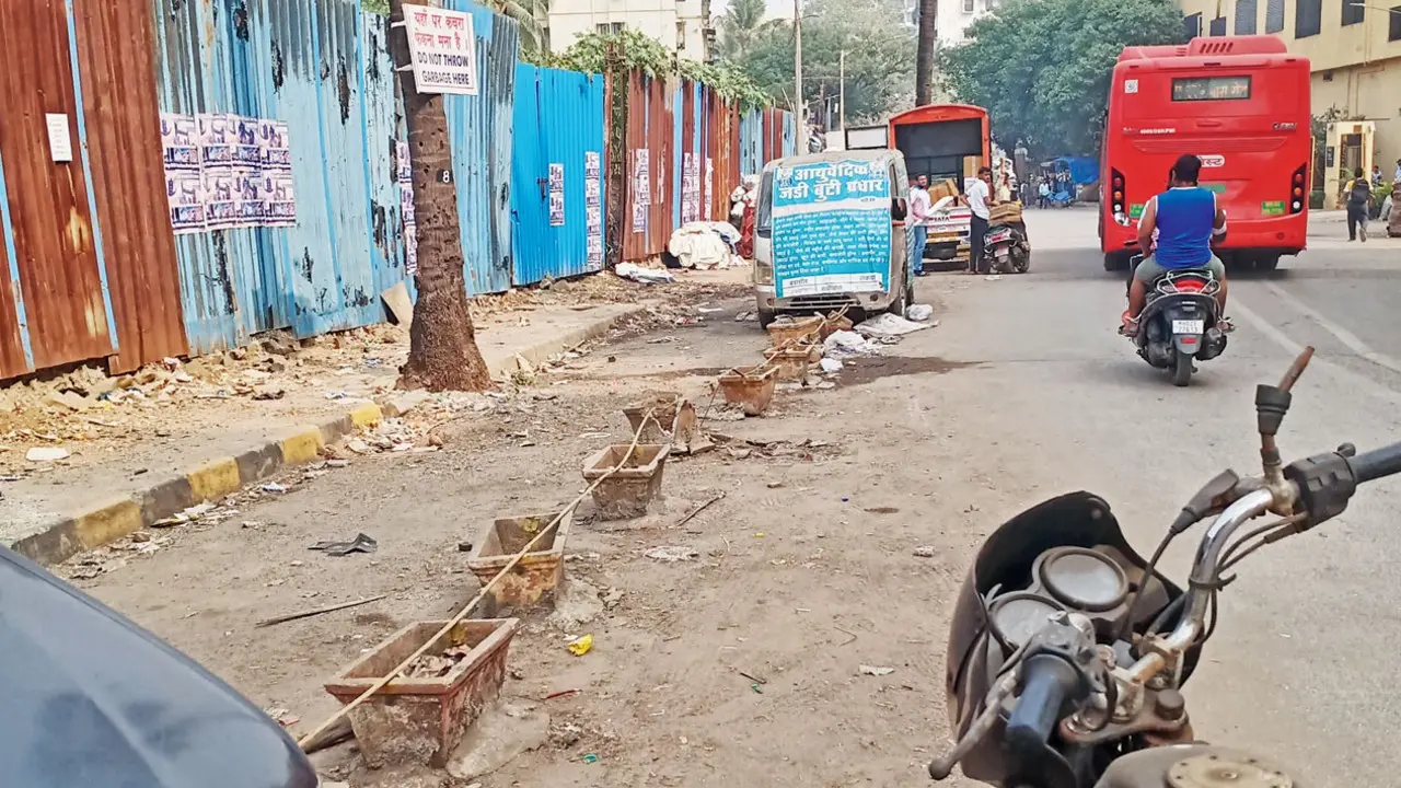 Freedom to walk a lot more An unusable footpath in Andheri West. Pic/Iqbal Gilani Mansuri
