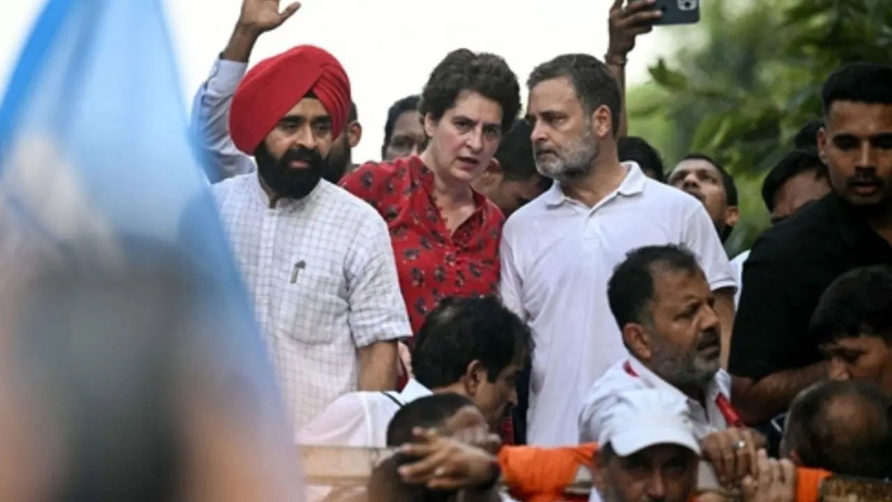 INDIA bloc march: BJP alleges Rahul Gandhi of manhandling pregnant journalist Congress party leaders Rahul Gandhi and Priyanka Gandhi Vadra during a protest march, demanding the resignation of CEC Gyanesh Kumar on Monday. PIC/AFP