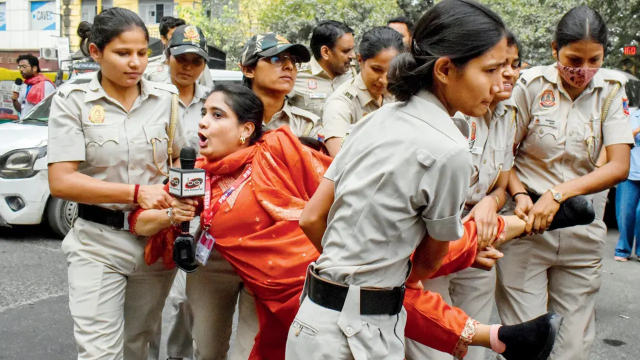 'Don't have PIB card? You're no reporter' Journalists allege that some of them were assaulted while others had their phones snatched. PICS/PTI
