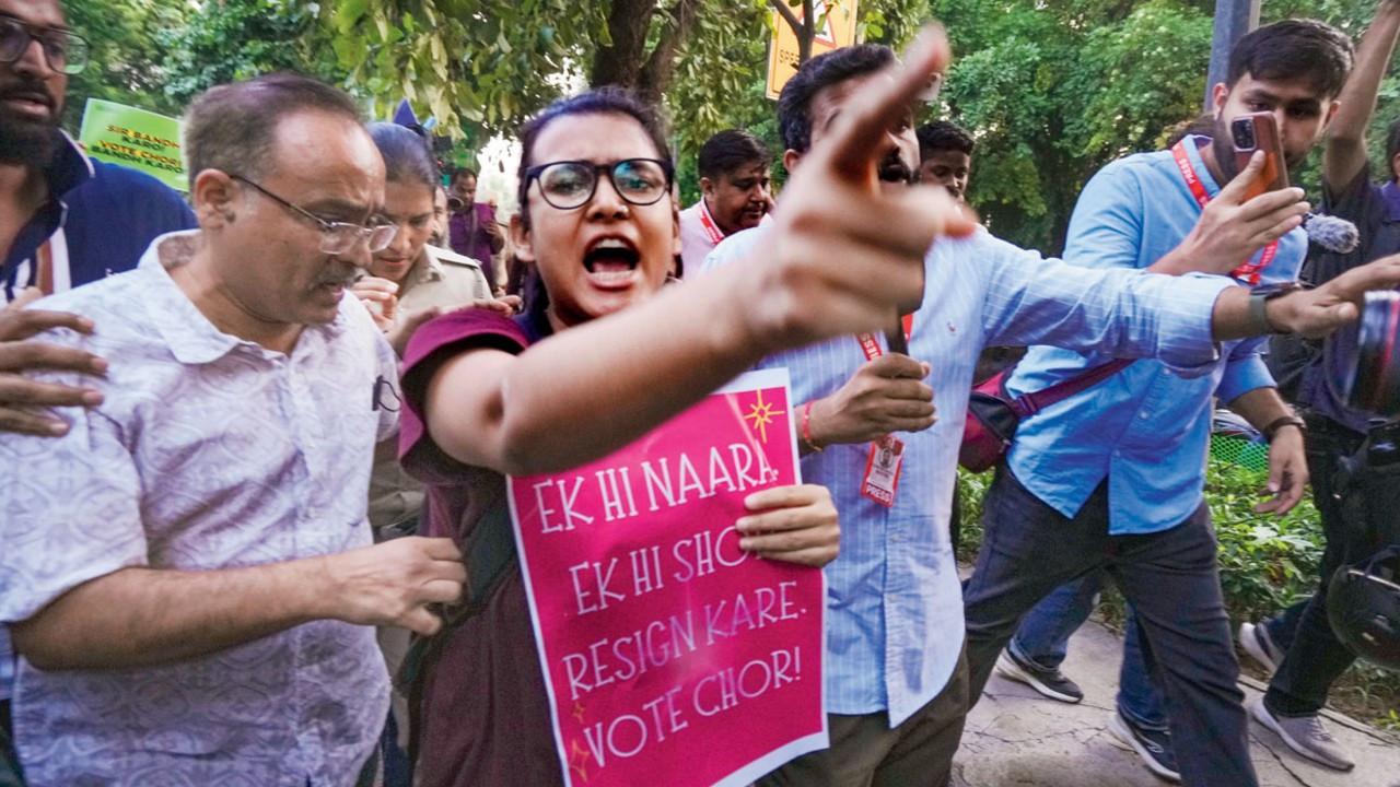 AISA chief Neha Bora with activists during a protest march called by Cockroach Janta Party in New Delhi on Friday. Pic/PTI