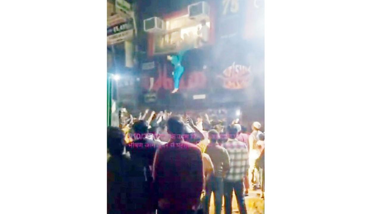 Delhi restaurant fire: Man throws toddler from first-floor window to safety A woman seen jumping from the window. PIC/X/@Navdeep52797284