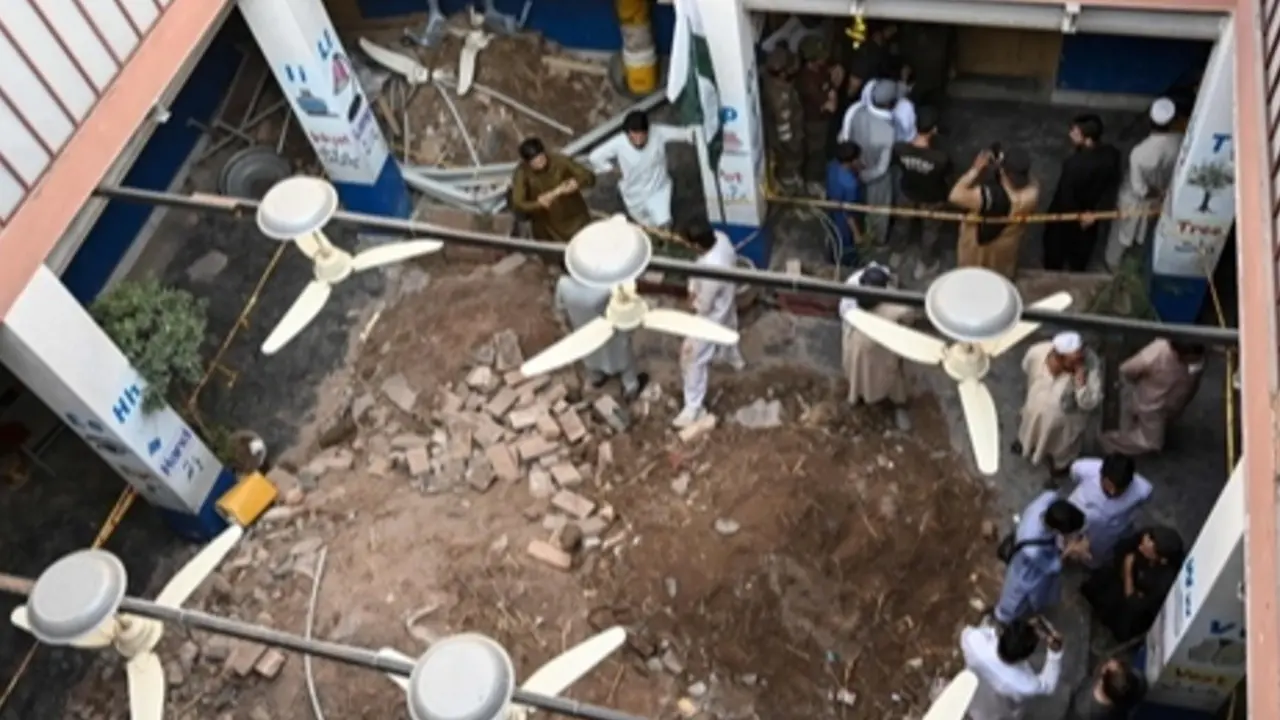 Pakistan school roof collapse: Death toll in Peshawar rises to 33, including 31 children People gather around debris and rubble lying in the courtyard of a school following a roof collapse, in Peshawar on Thursday. PIC/AFP