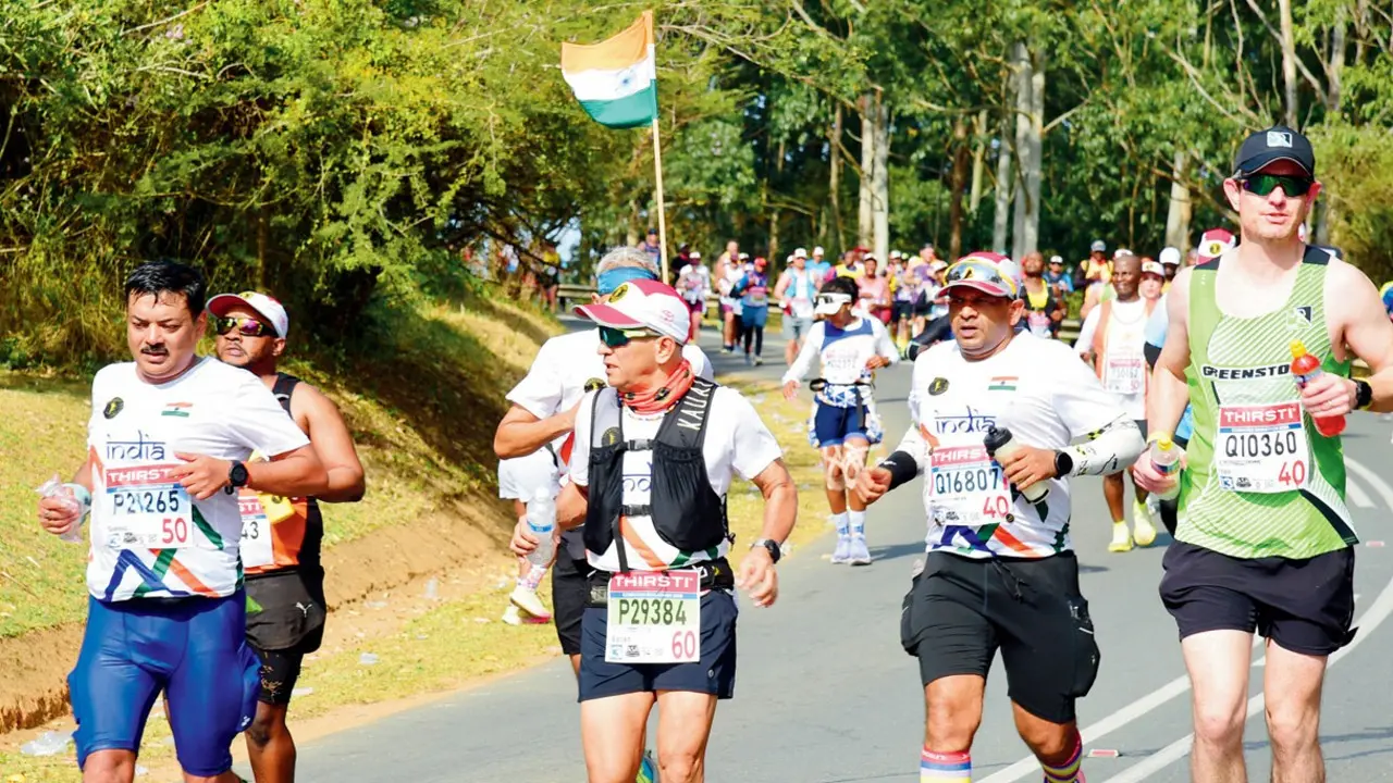 Mumbai marathoner Satish Gujaran seeks more international slots for 2027 Comrades Marathon Satish Gujaran (second from left) in bib no. 29384, running the 2026 edition, with the Indian flag flying high Pics/By Special Arrangement