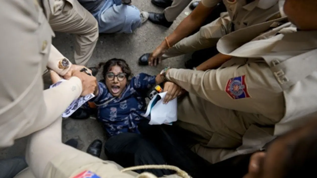 IN PHOTOS: Delhi Police detain protesters marching against SIR towards EC Delhi Police detained protesters marching against electoral roll revision towards ECI headquarters, as restrictions on large gatherings were imposed across central Delhi. (PIC/PTI)