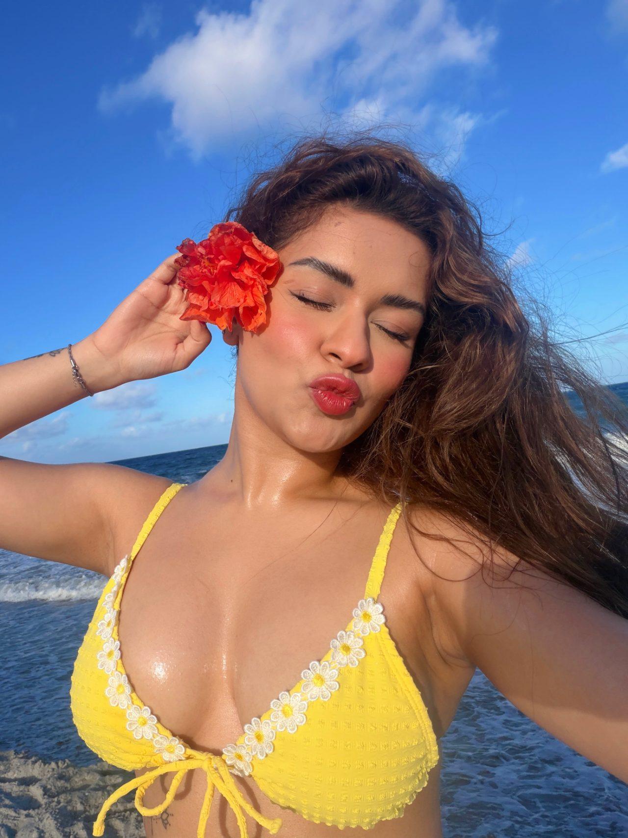 In the pictures, Avneet looks stunning in a yellow bikini that complements the sunny vacation setting.