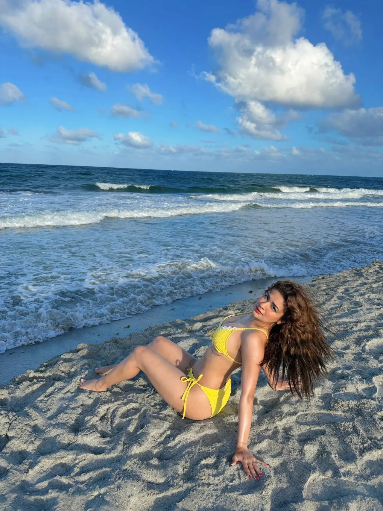 The pictures capture her beach-ready look, adding another striking moment to her ever-growing collection of fashionable appearances on social media.