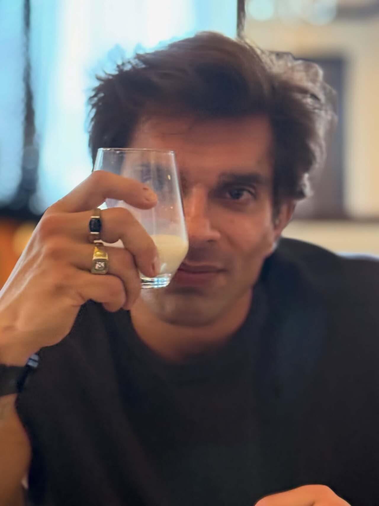 Karan Singh Grover poses at the breakfast table, holding up his drink while showing off his signature rings Karan Singh Grover poses at the breakfast table, holding up his drink while showing off his signature rings