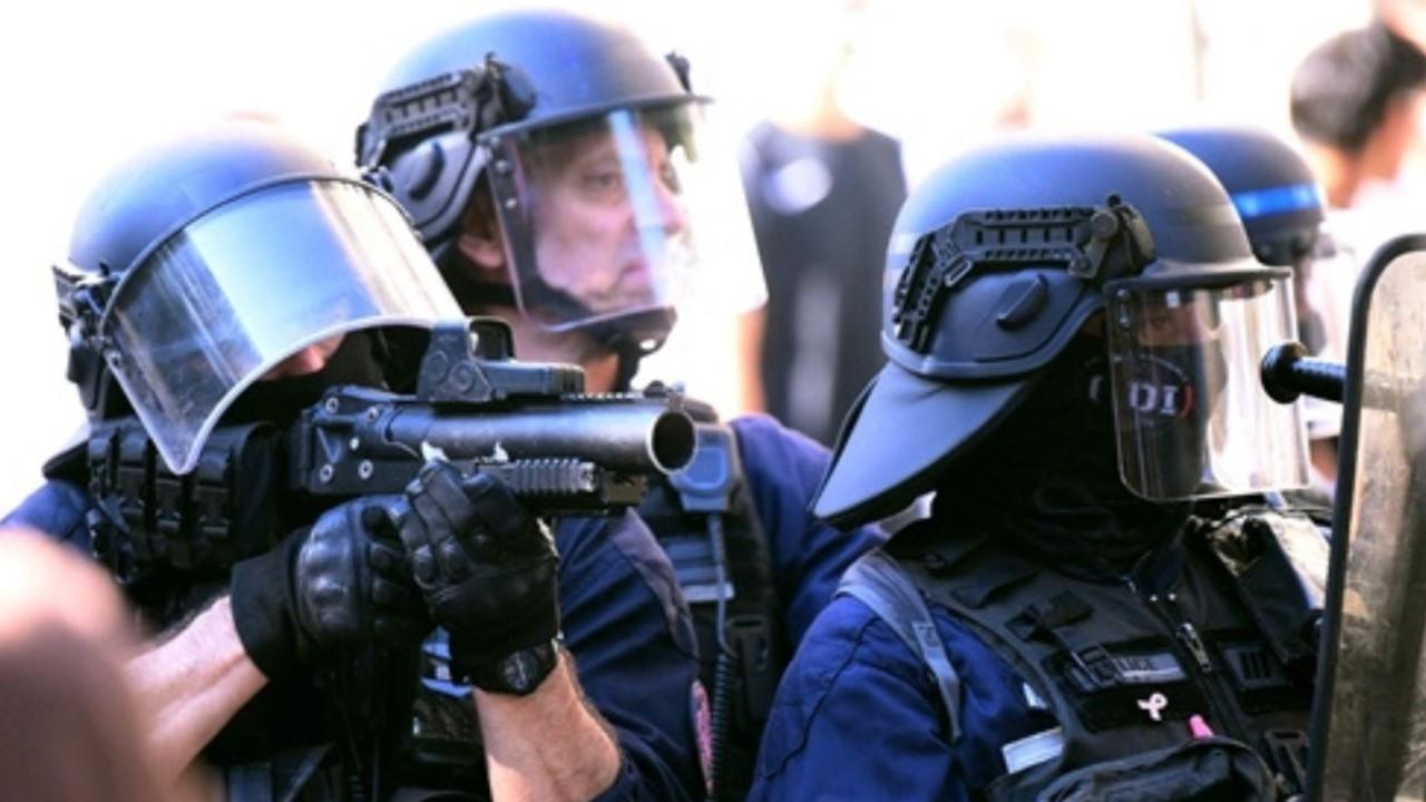 France bans stun grenade use at high school protests amid police brutality claims; 6,500 protesters arrested A police officer aims with his 40 millimetre rubber defensive bullet launcher during a demonstration in Bordeaux, southwestern France, on Tuesday. PIC/AFP