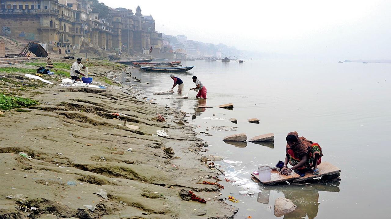People wash clothes at ghats on the banks of Ganga river. Representation pic/iStock