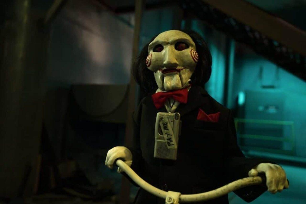 A simple yet spooky look to recreate is Billy the Puppet from Saw. Paint your face stark white with signature bright red cheek spirals, a black tuxedo, and a blood-red bow tie. A simple yet spooky look to recreate is Billy the Puppet from Saw. Paint your face stark white with signature bright red cheek spirals, a black tuxedo, and a blood-red bow tie.