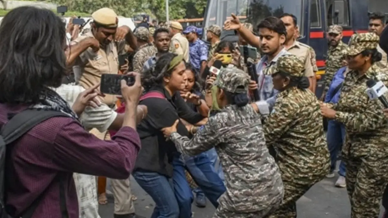 Delhi CJP protest: UN human rights' body expresses concern over mass detentions Security personnel detain activists during a protest organised by the Cockroach Janta Party (CJP) demanding the resignation of (CEC) Gyanesh Kumar in New Delhi, on Saturday. PIC/PTI