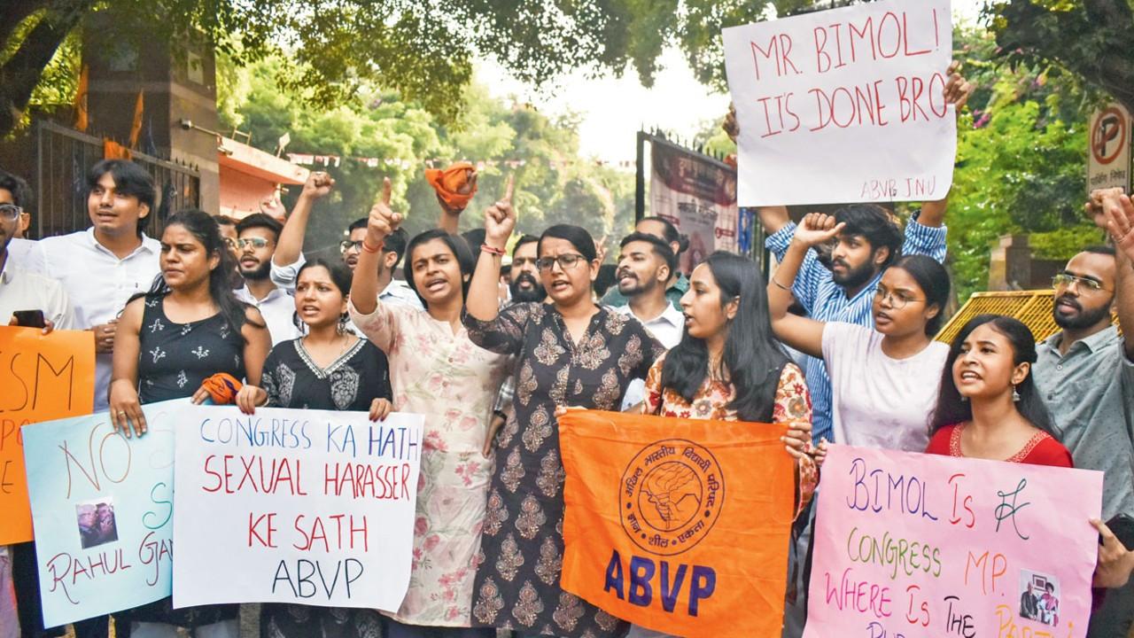 BJP women MPs seek action against Akoijam after JNU sacks him amid allegations ABVP students stage a protest against Congress MP and former JNU professor Angomcha Bimol Akoijam. Pic/PTI