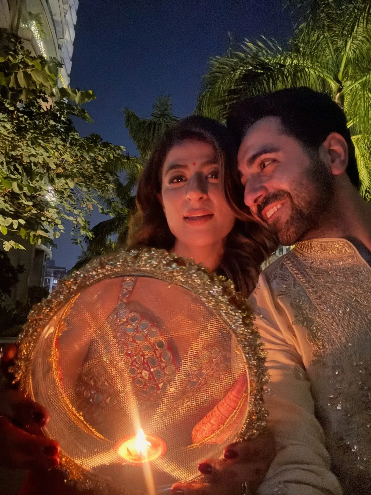 Ayushmann Khurrana and Tahira Kashyap set Karwa Chauth goals in complementing red and gold ensembles, along with a hanging decor with a red heart and their names. Ayushmann Khurrana and Tahira Kashyap set Karwa Chauth goals in complementing red and gold ensembles, along with a hanging decor with a red heart and their names.